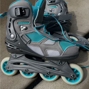 Gray and Teal Rollerblades